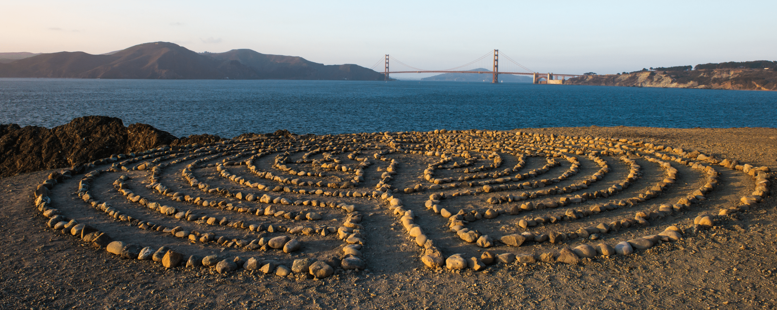 a rock formation at the mile rock beach in san francisco