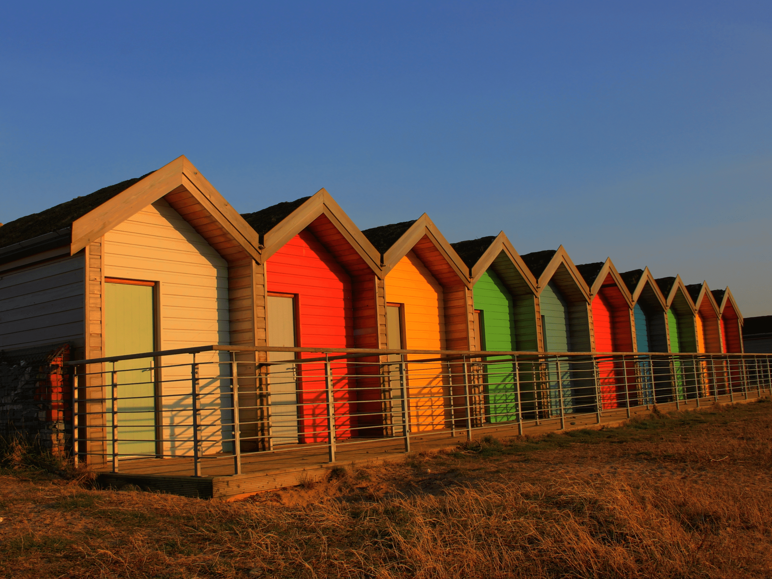 colourful coastal huts at beach side