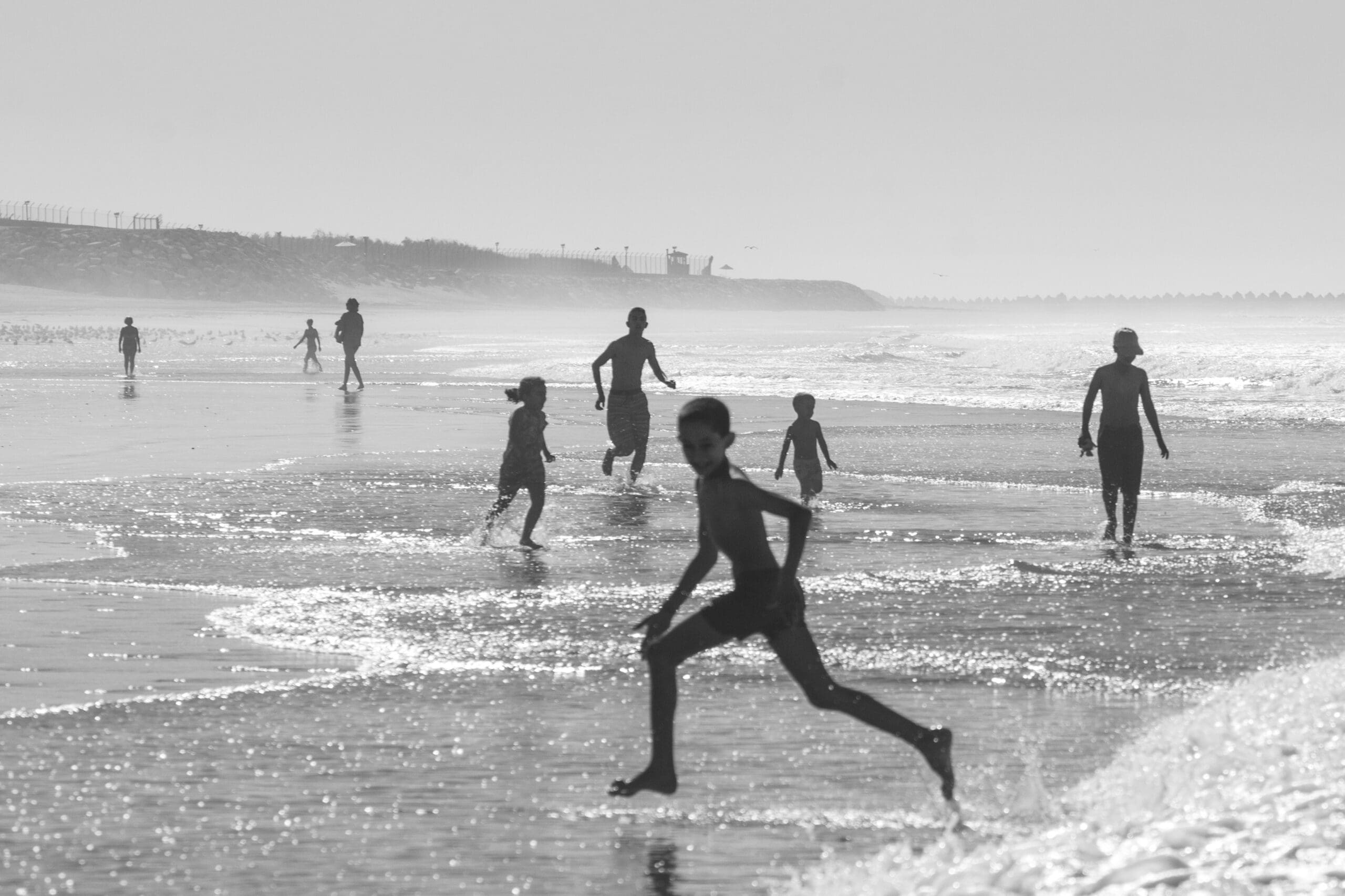 children running and playing at the koki beach park