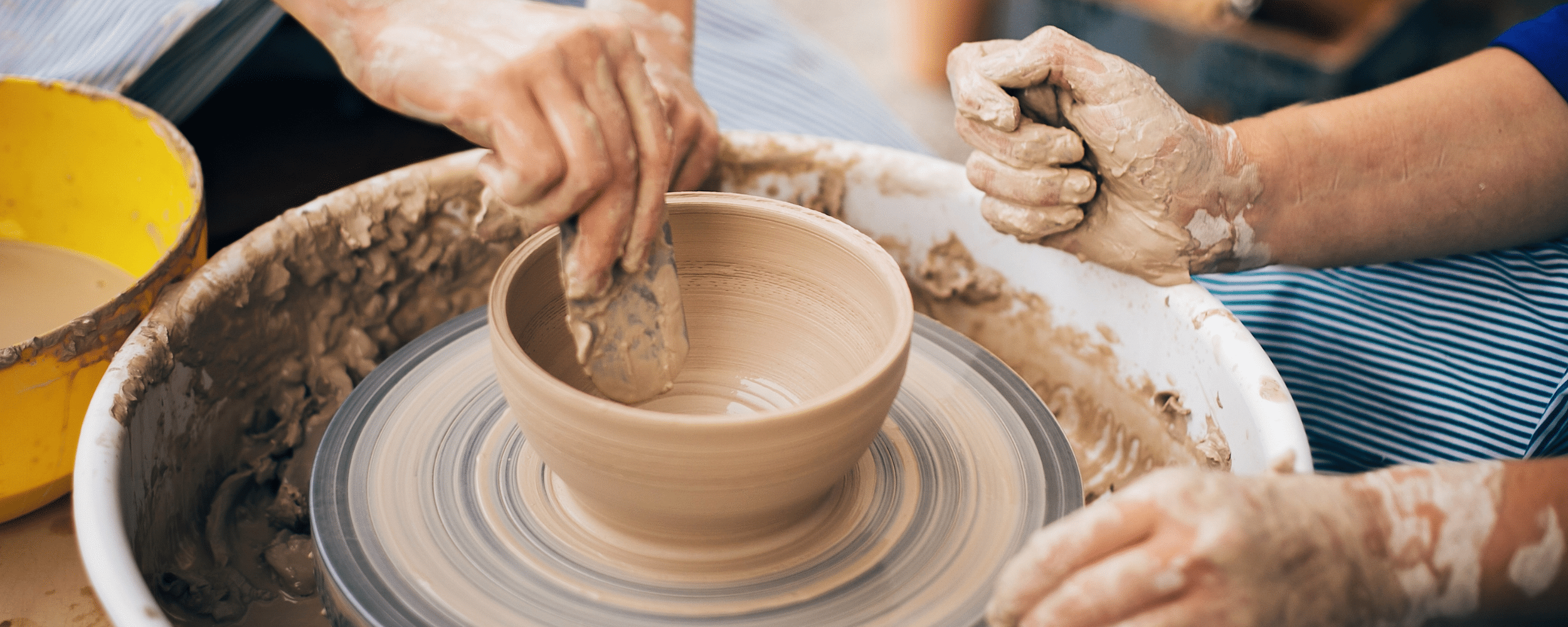 local artisans involved in pottery making at the craft village