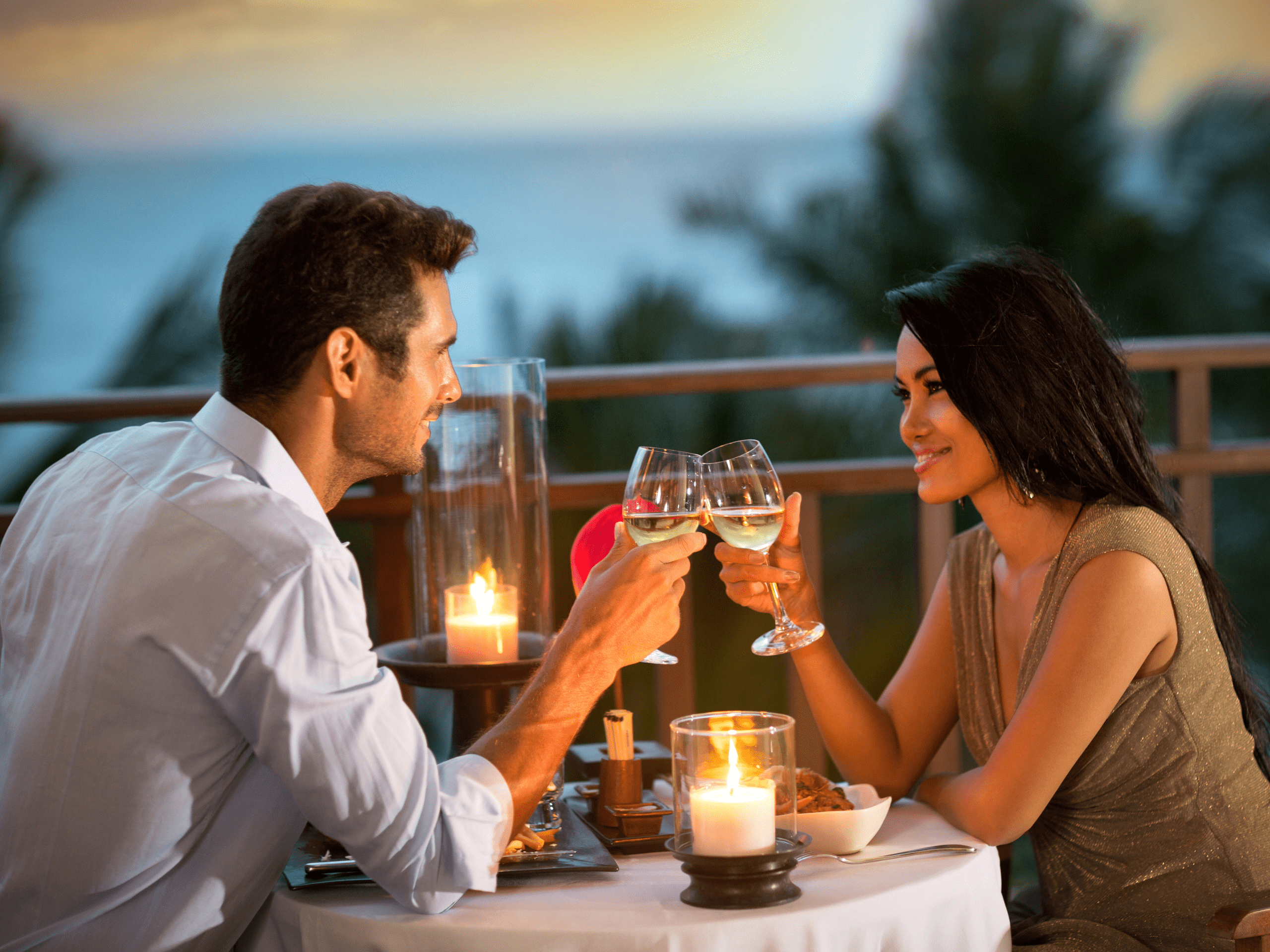 a couple enjoying a romantic dinner cruise along the detroit river