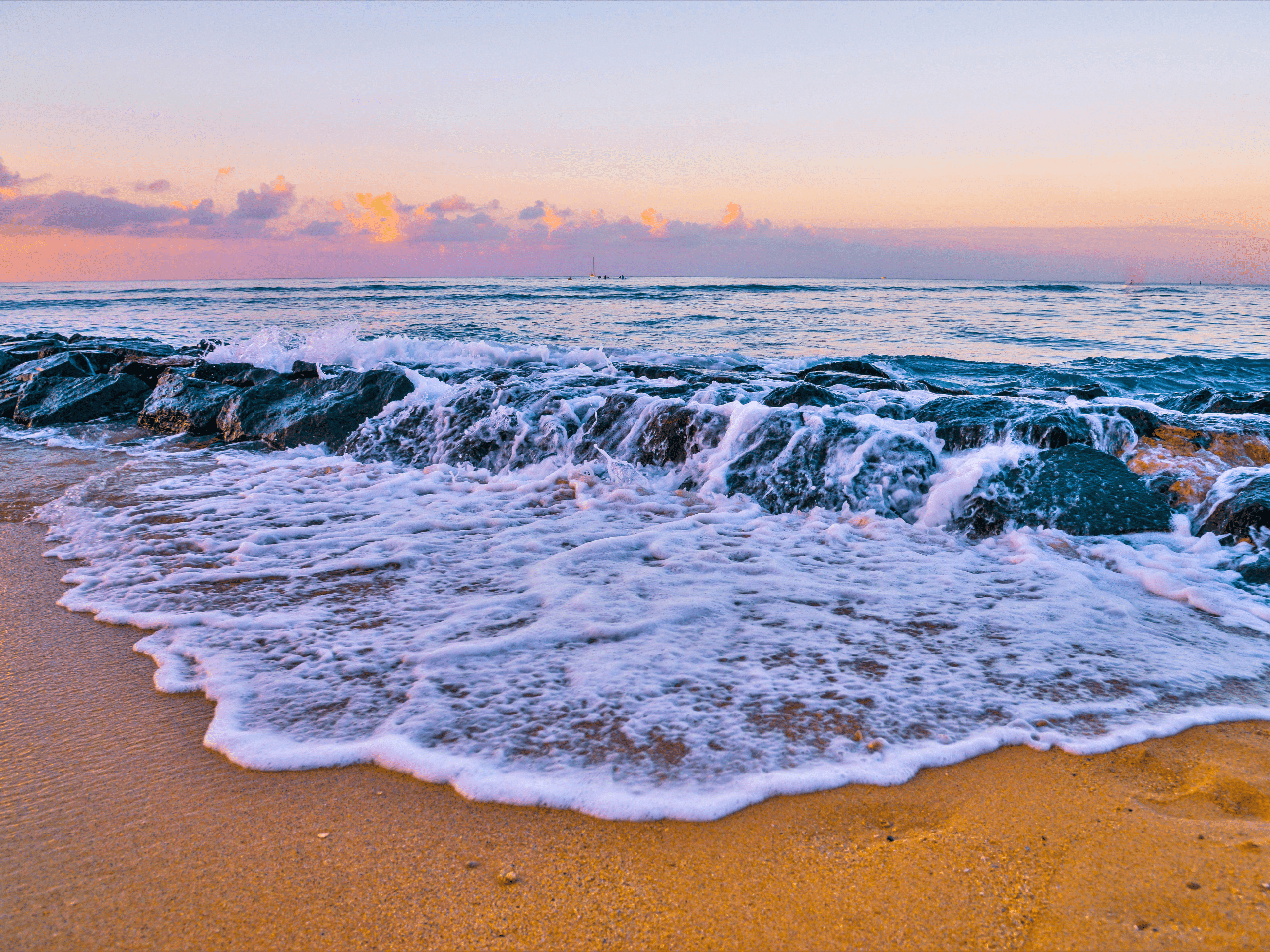 tides embracing the beach sand