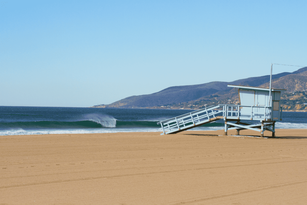 a lifeguard station at the zuma beach a dog friendly beach