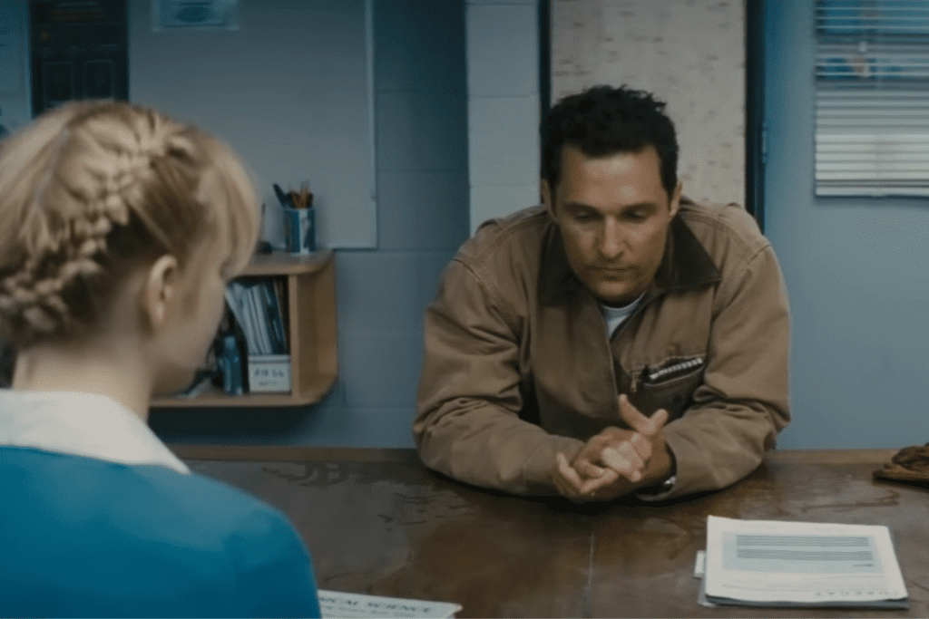 a scene from the movie interstellar. a conversation between the hero and a blonde woman.