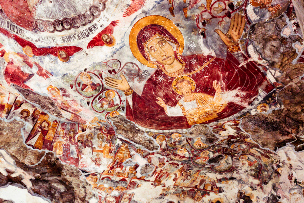 Sumela Monstery fresco of mother Mary and infant Jesus among other frescoes.