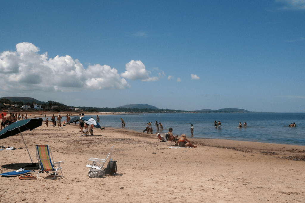 Many people engaged in beach activities at playa las flores beach in el salvador beaches.